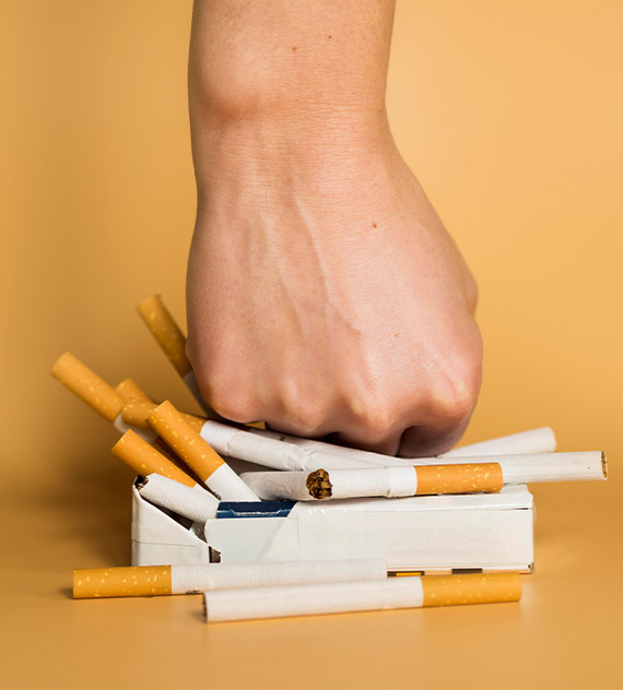 Fist smashing cigarettes